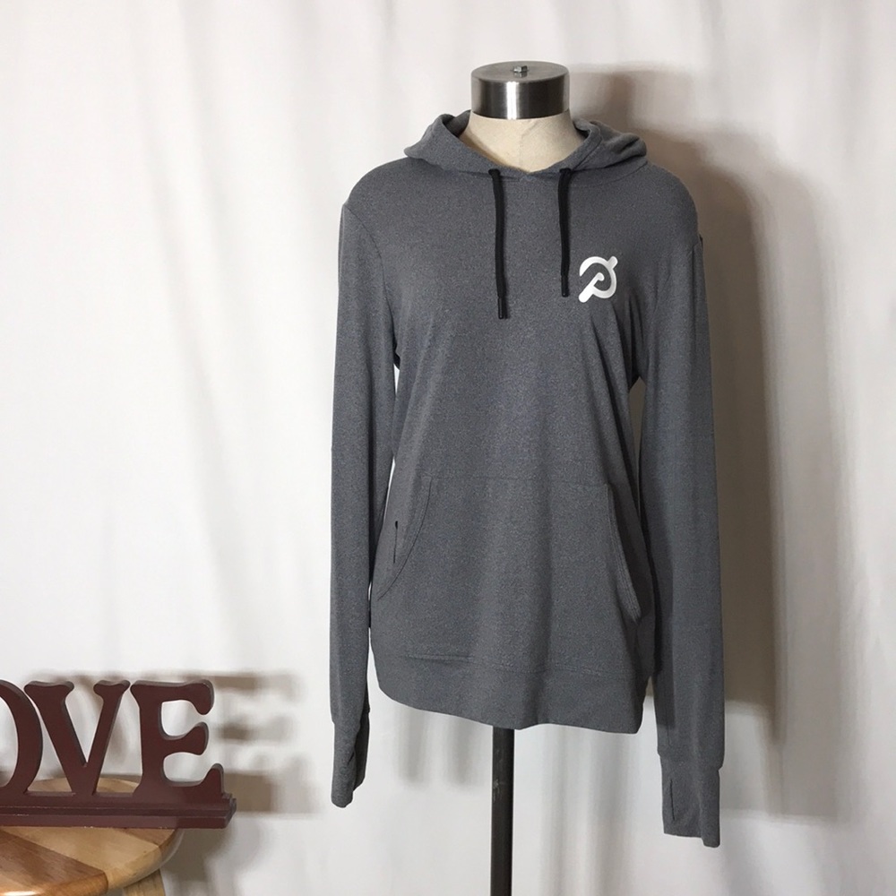 Small Peloton woman’s gray hoodie sweater